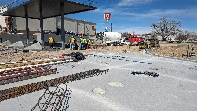 A group of construction workers are working on a construction site.