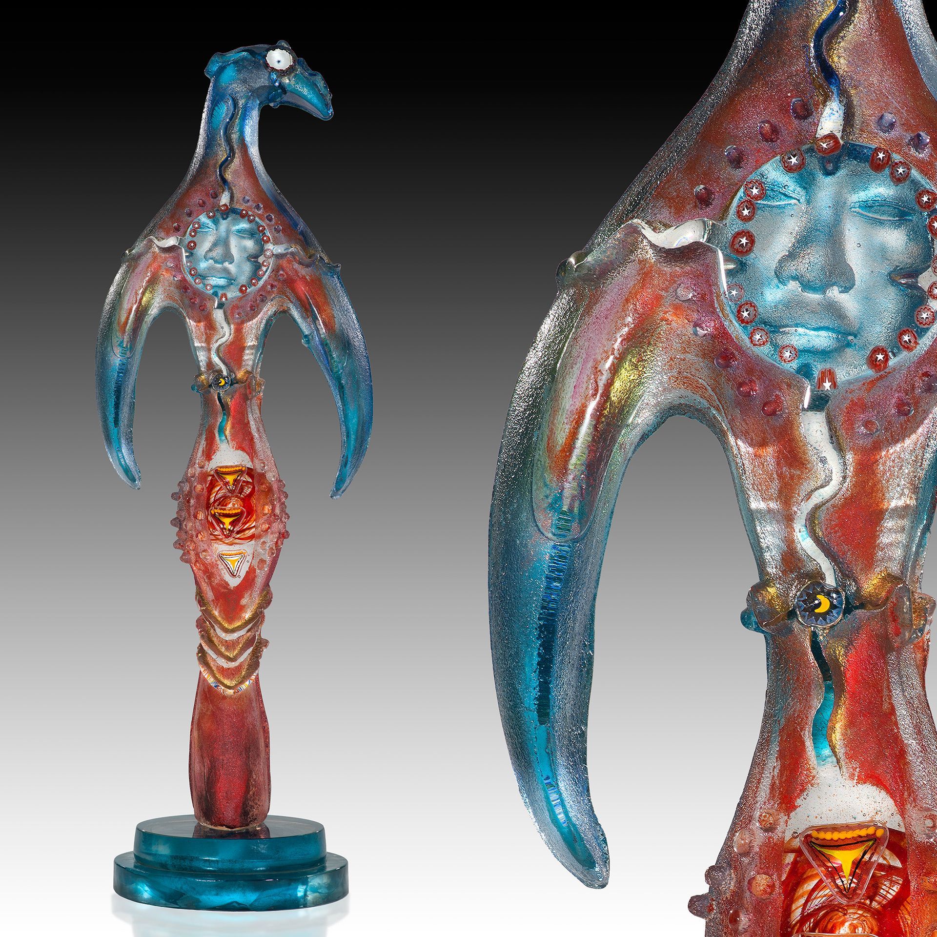 A statue of a bird with a face on it