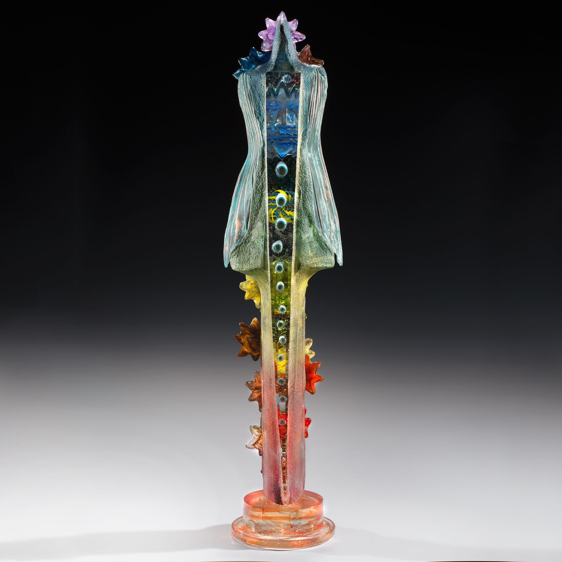 A sculpture of a mannequin with flowers on it