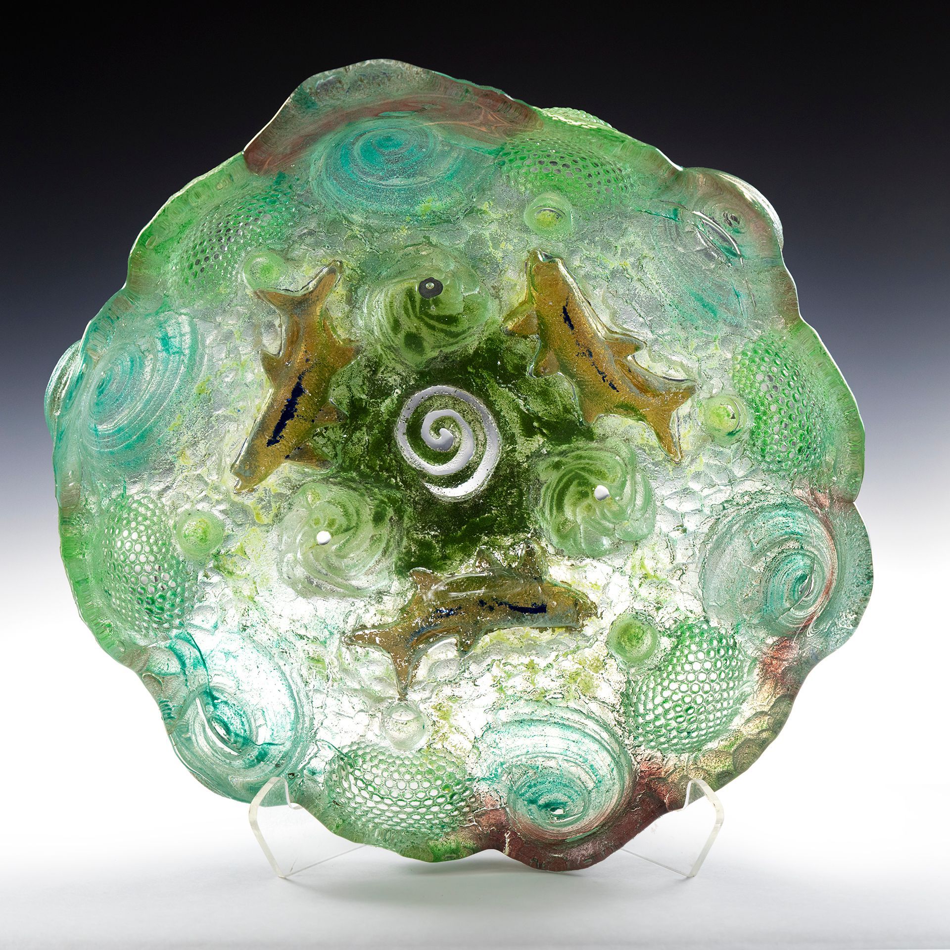 A green plate with a spiral in the middle