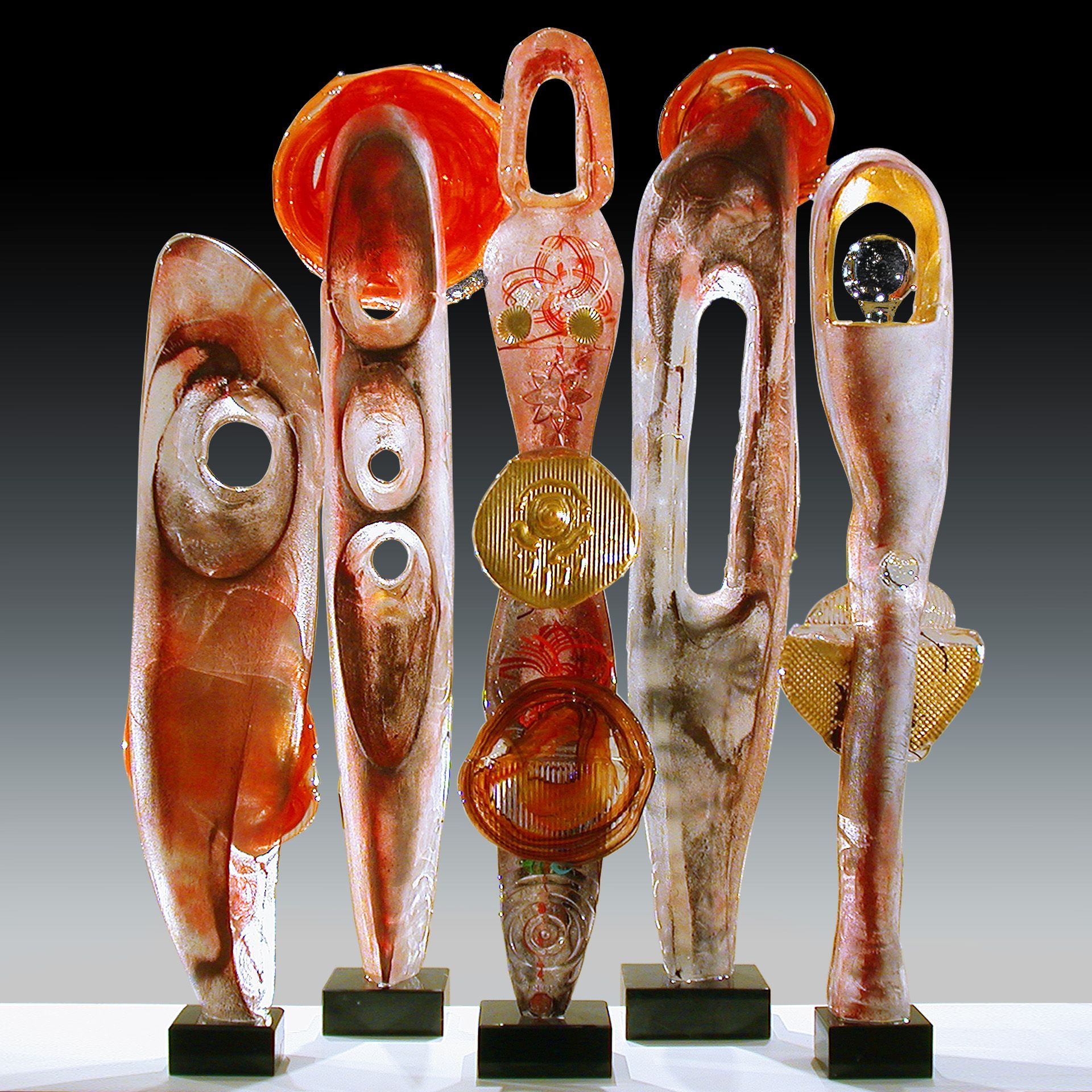 A group of sculptures are lined up on a table