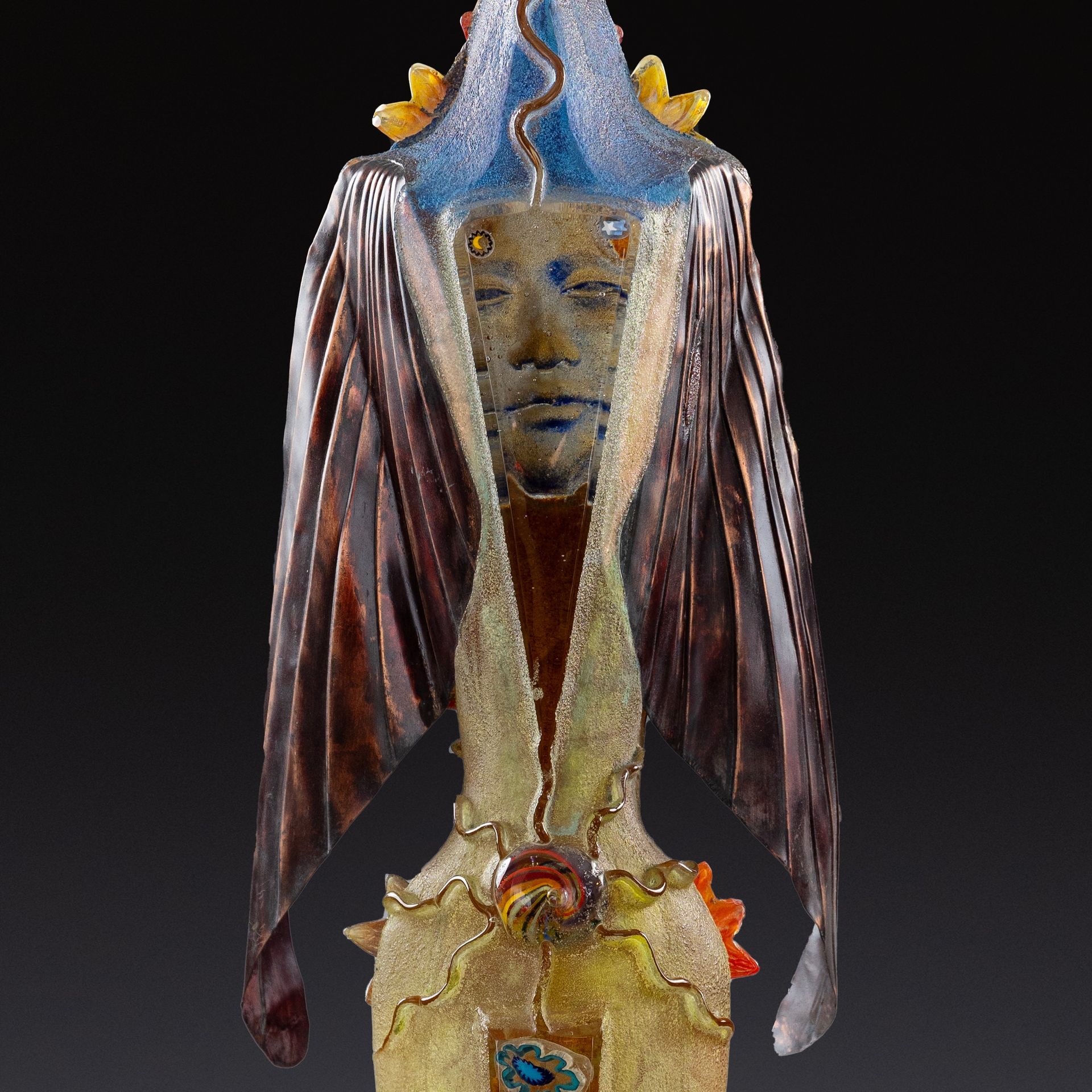 A statue of a woman with a blue hat on her head