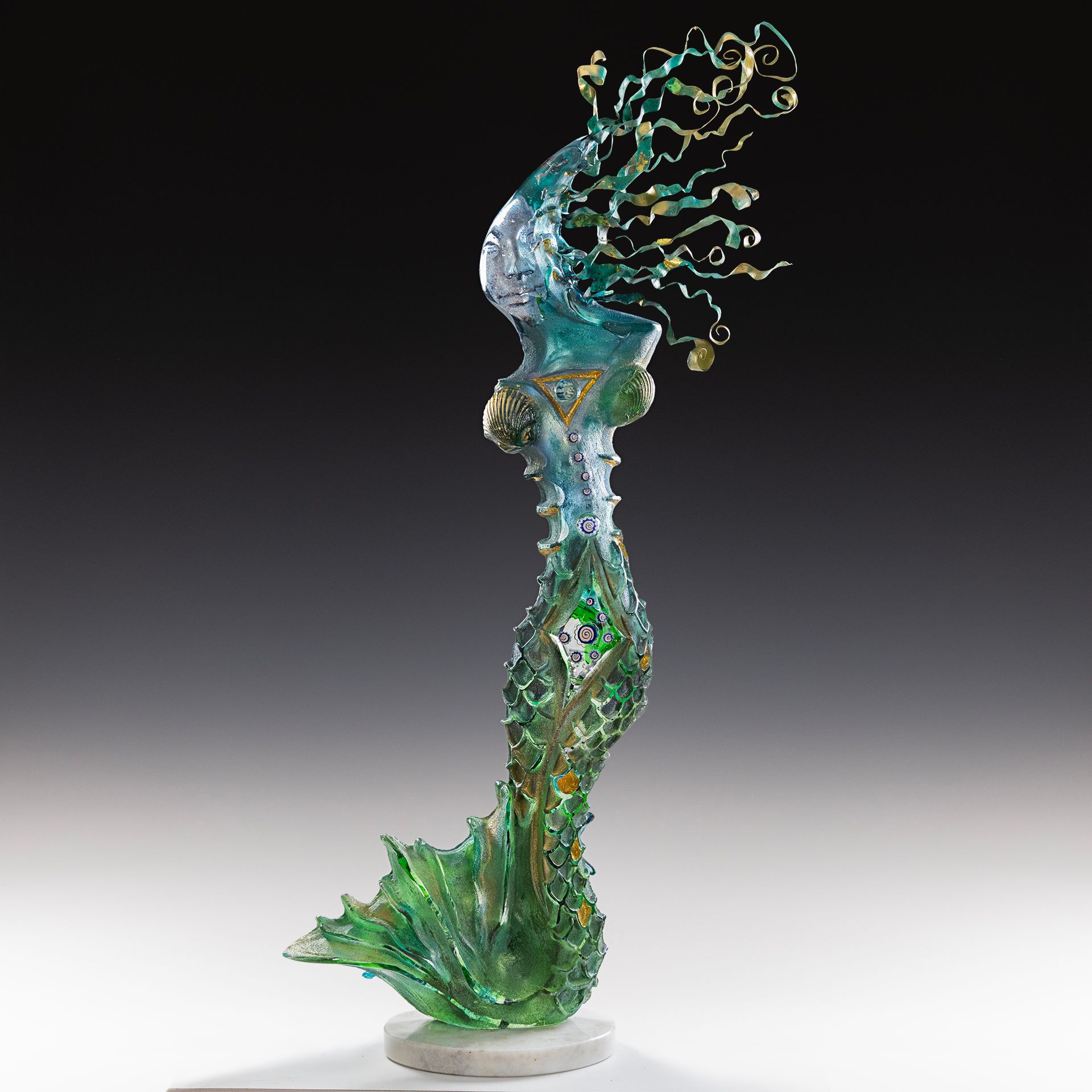 A statue of a jellyfish with a green tail