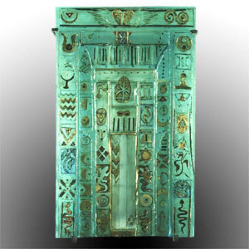 A green door with a lot of symbols on it