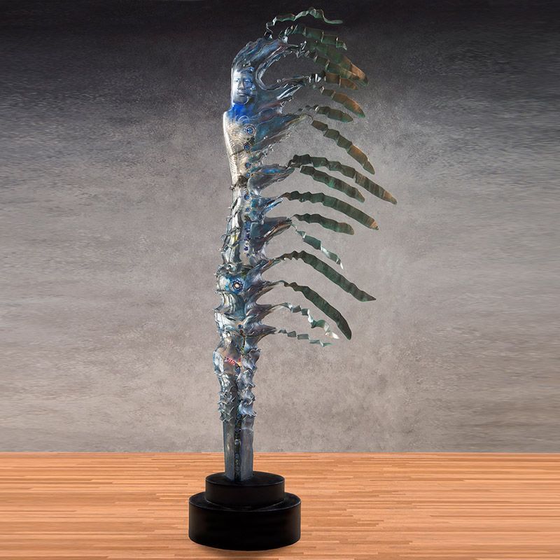 A sculpture is sitting on a wooden table