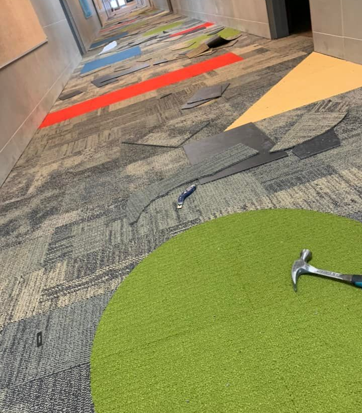 A ground-level shot of the hotel carpet flooring installation in progress.