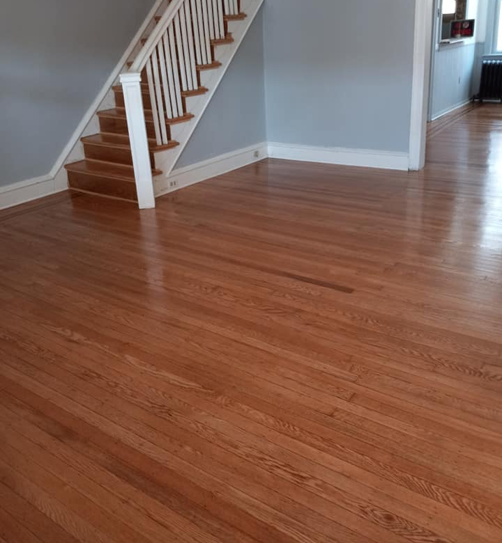 Shiny and shart hardwood floors have been installed in this living room.