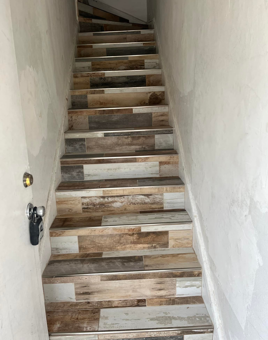 Ceramic tile installed on a flight of stairs