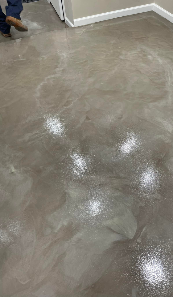 Textured epoxy floor pour in a luxurious home.