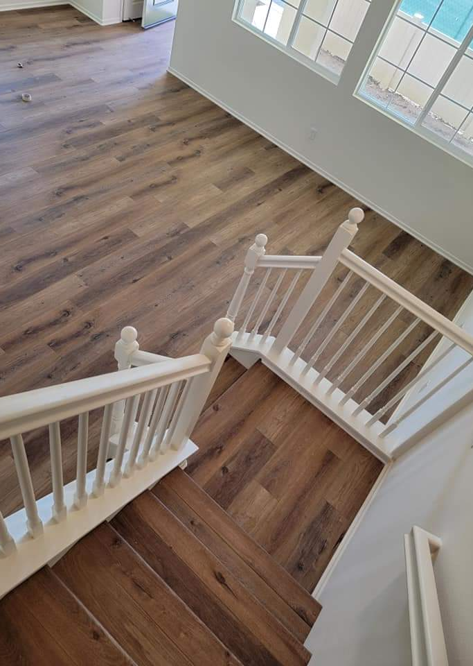Engineered hardwood floors installed right down this set of stairs and throughout the floor level.