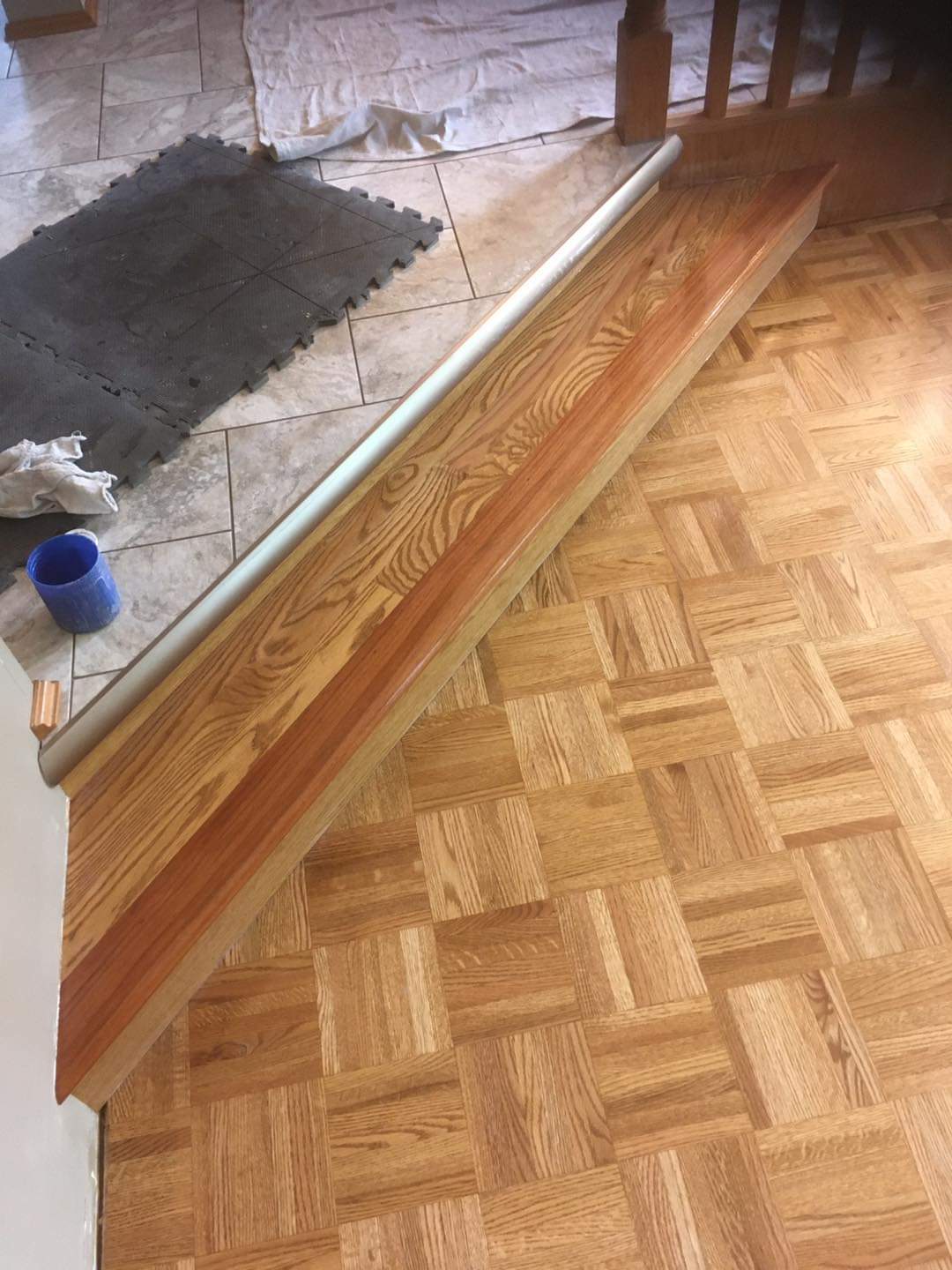 Great attention to detail was paid to installing the transition properly in this solid wood flooring job.