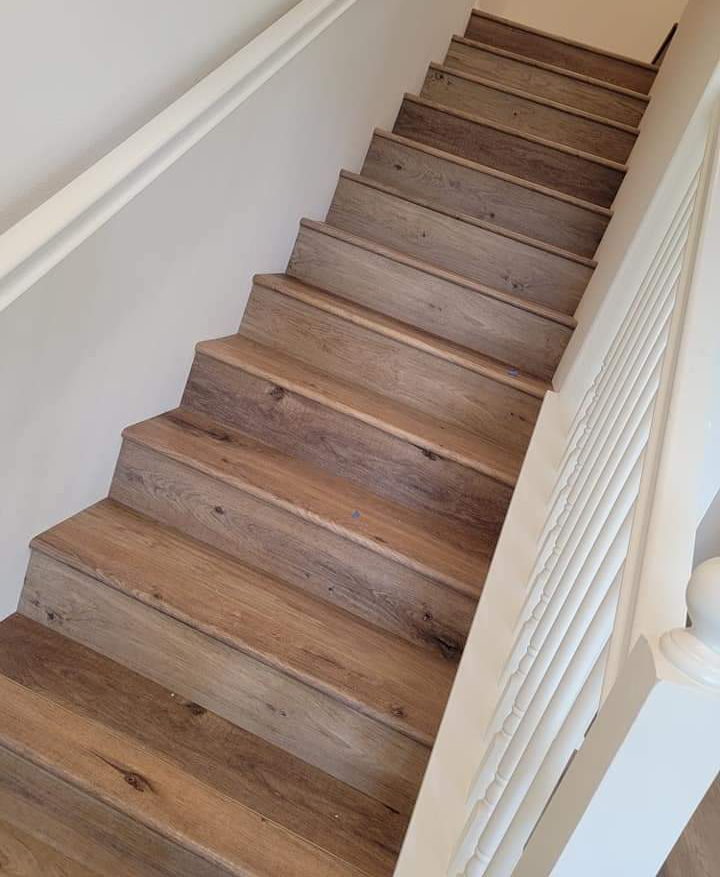 This set of stairs looks great now that they've been skinned with engineered hardwood.
