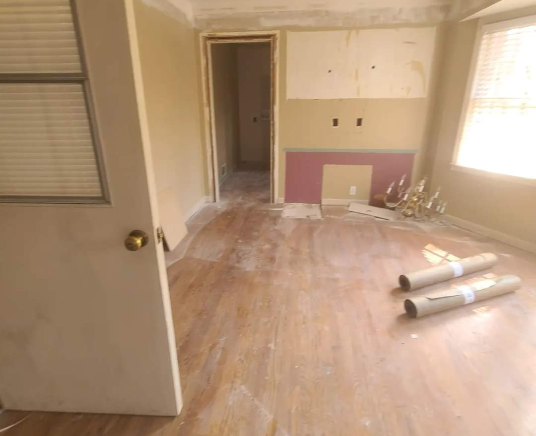 This room will look bright and new once the solid wood floor installation is complete.