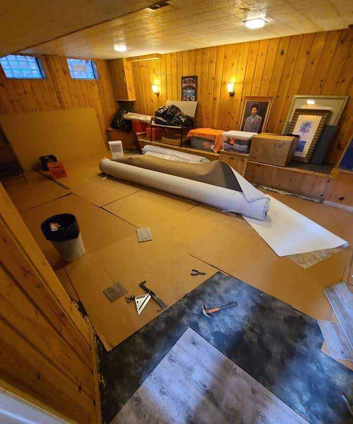 Carpet installation prep in a home basement.