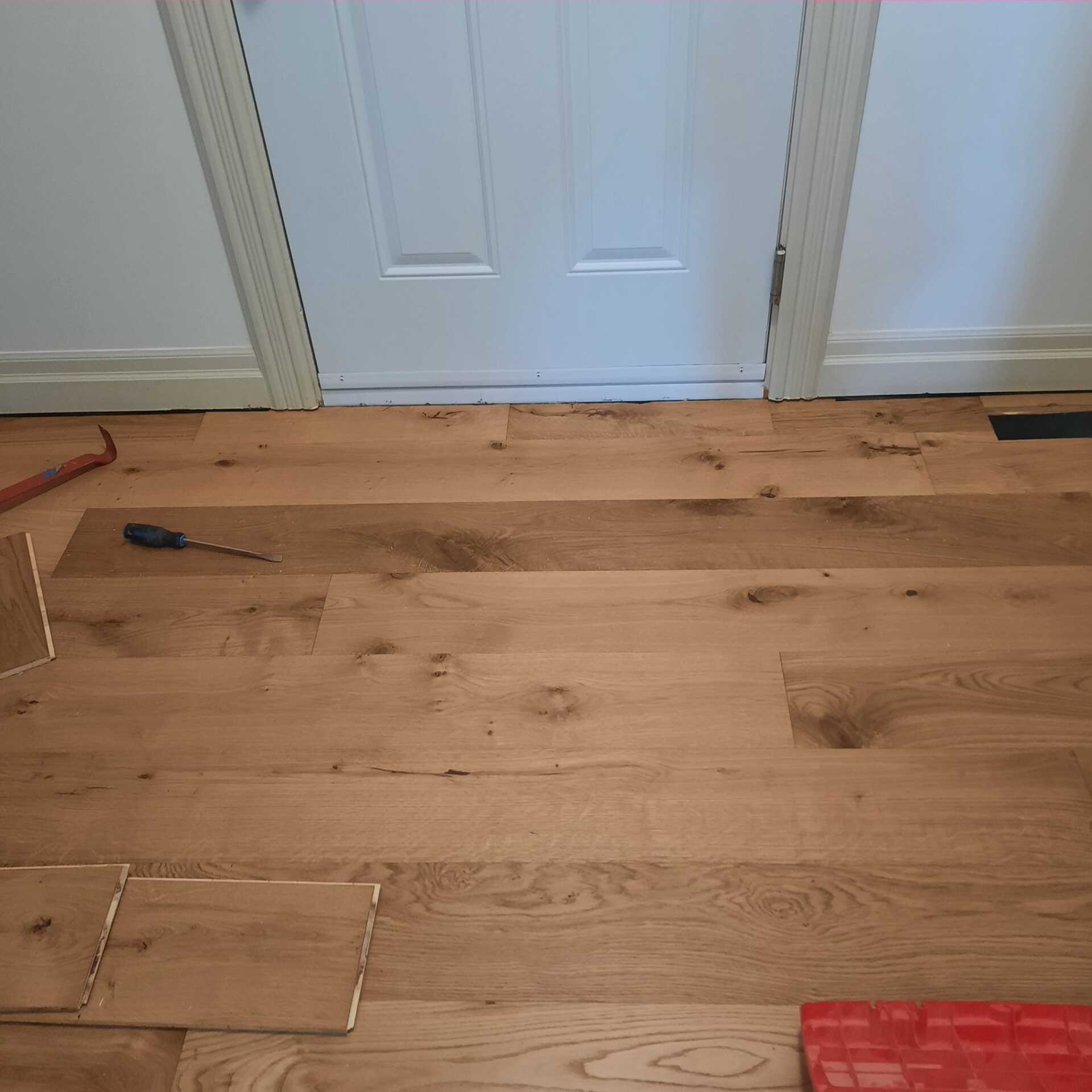 Another engineered flooring installation that looks nearly identical to solid hardwood flooring.