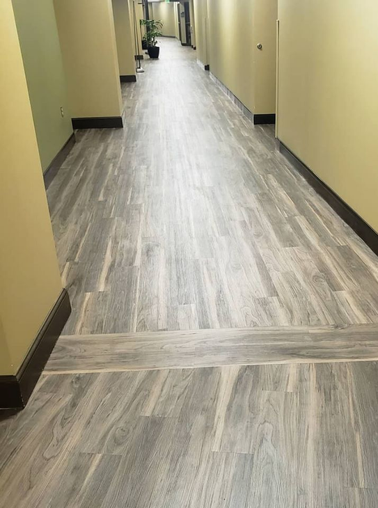 Luxury Vinyl Plank installed throughout a commercial setting.