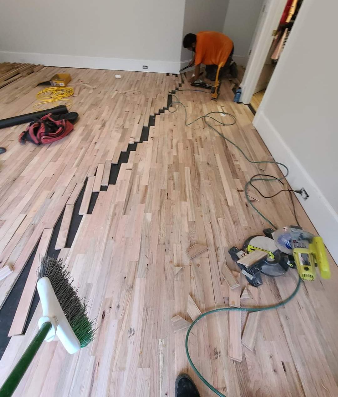 This hardwood floor installation is nearing completion.