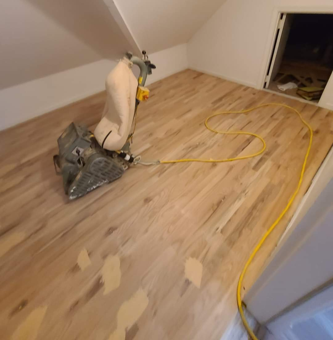 The finishing touches being put on this hardwood flooring install.