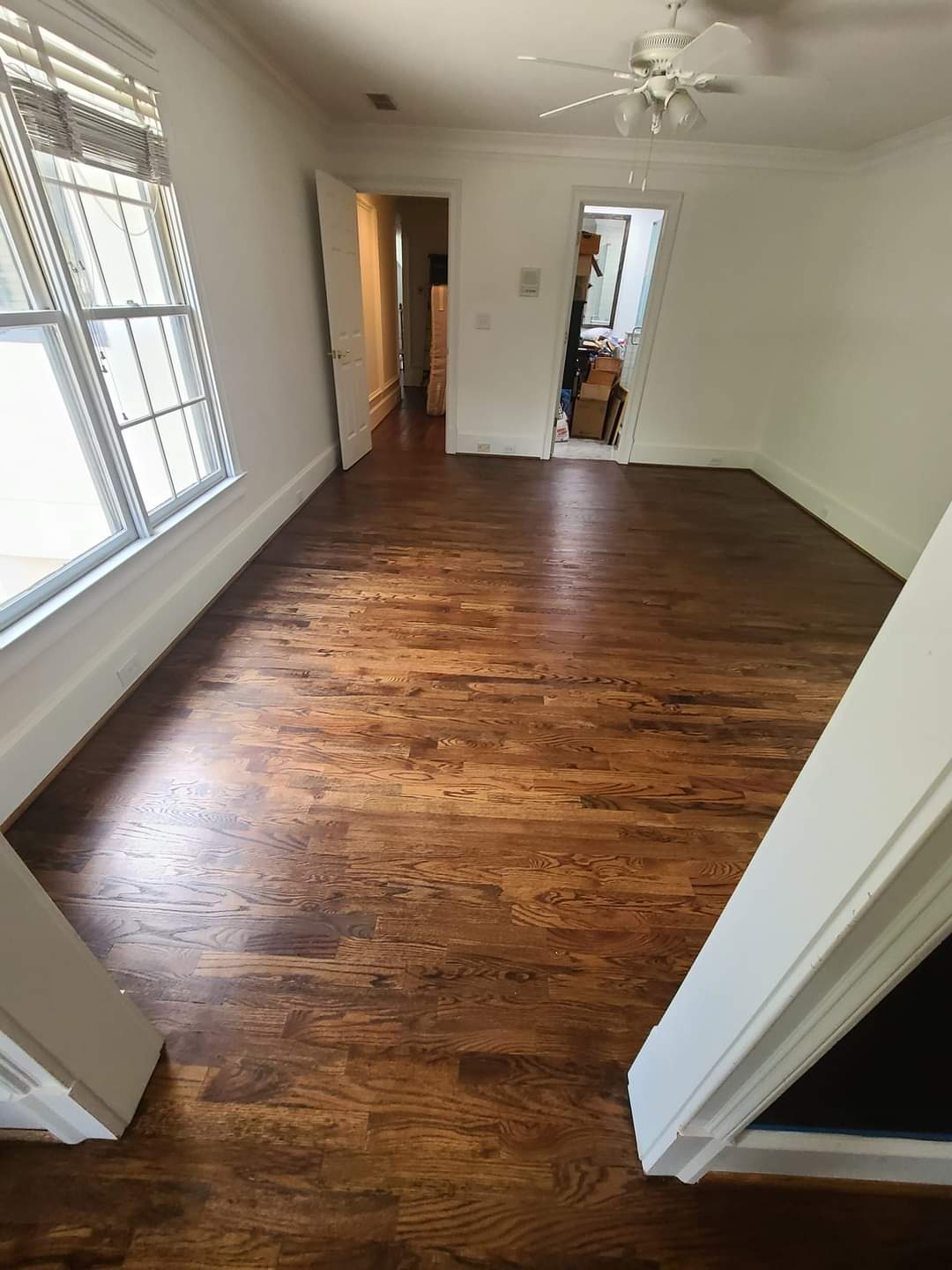 This old construction home has beautiful moldings and a gorgeous hardwood floor installation.