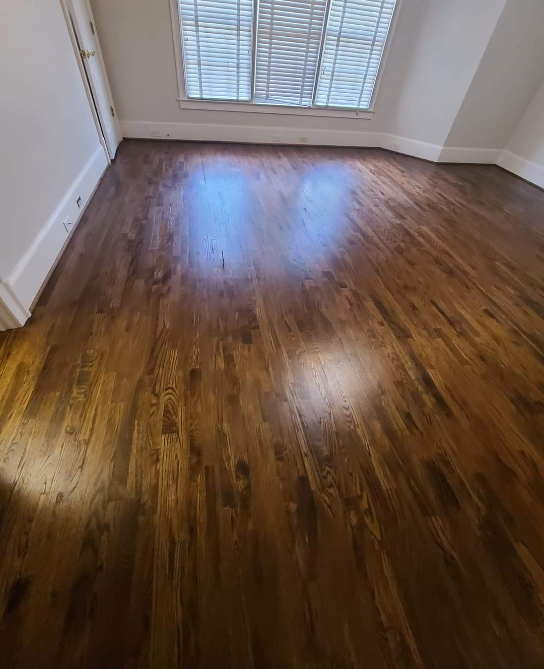 We love the dark finish on this freshly installed hardwood floor.