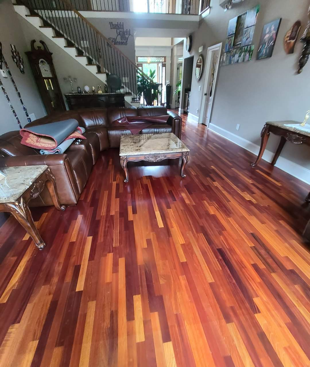 The hardwood floor has been installed, stained and polished for a completely finished look.