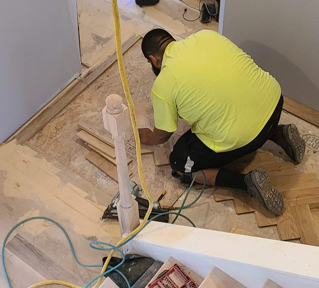 Our flooring contractors hard at work in this flooring replacement project.