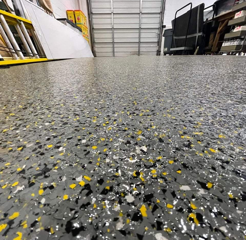 Sharp looking flake epoxy floors have been installed on this garage floor.