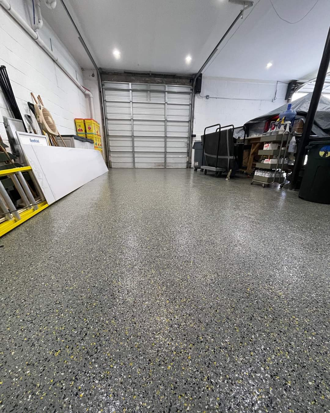 This garage floor looks sharp with epoxy flooring throughout.
