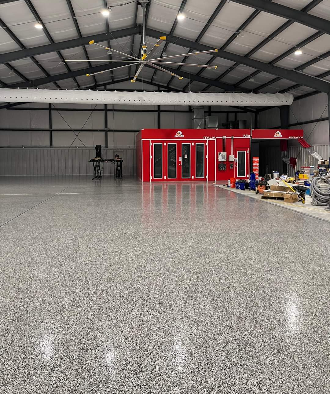 This large garage looks great with epoxy flooring.