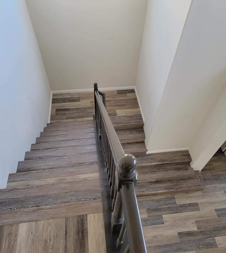 A set of stairs with a beautiful vinyl flooring install.