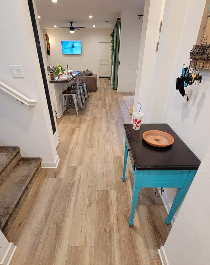 The same kitchen has a run to the door with a great looking vinyl sheet flooring install.