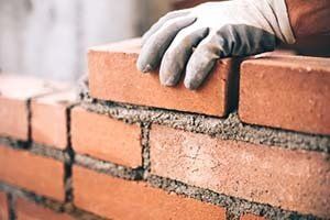 Installing bricks — Chimneys in  Kern County, CA