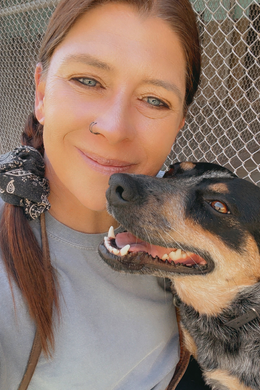 Megan, Canine Behavior Specialist at Johnny's Doghouse, with a dog