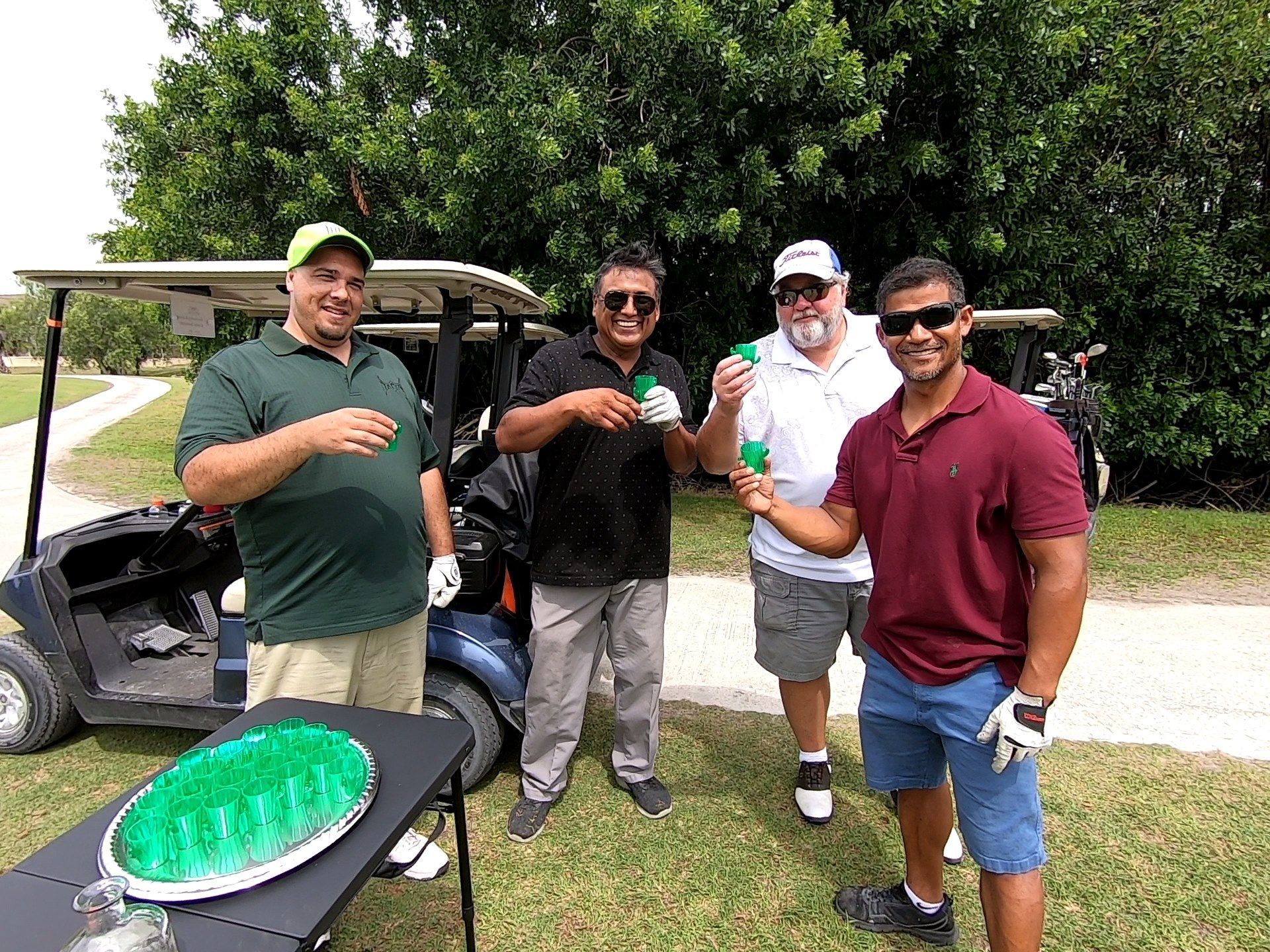Men Standing Next to A Golf Cart — North Port, FL — Team Doogie