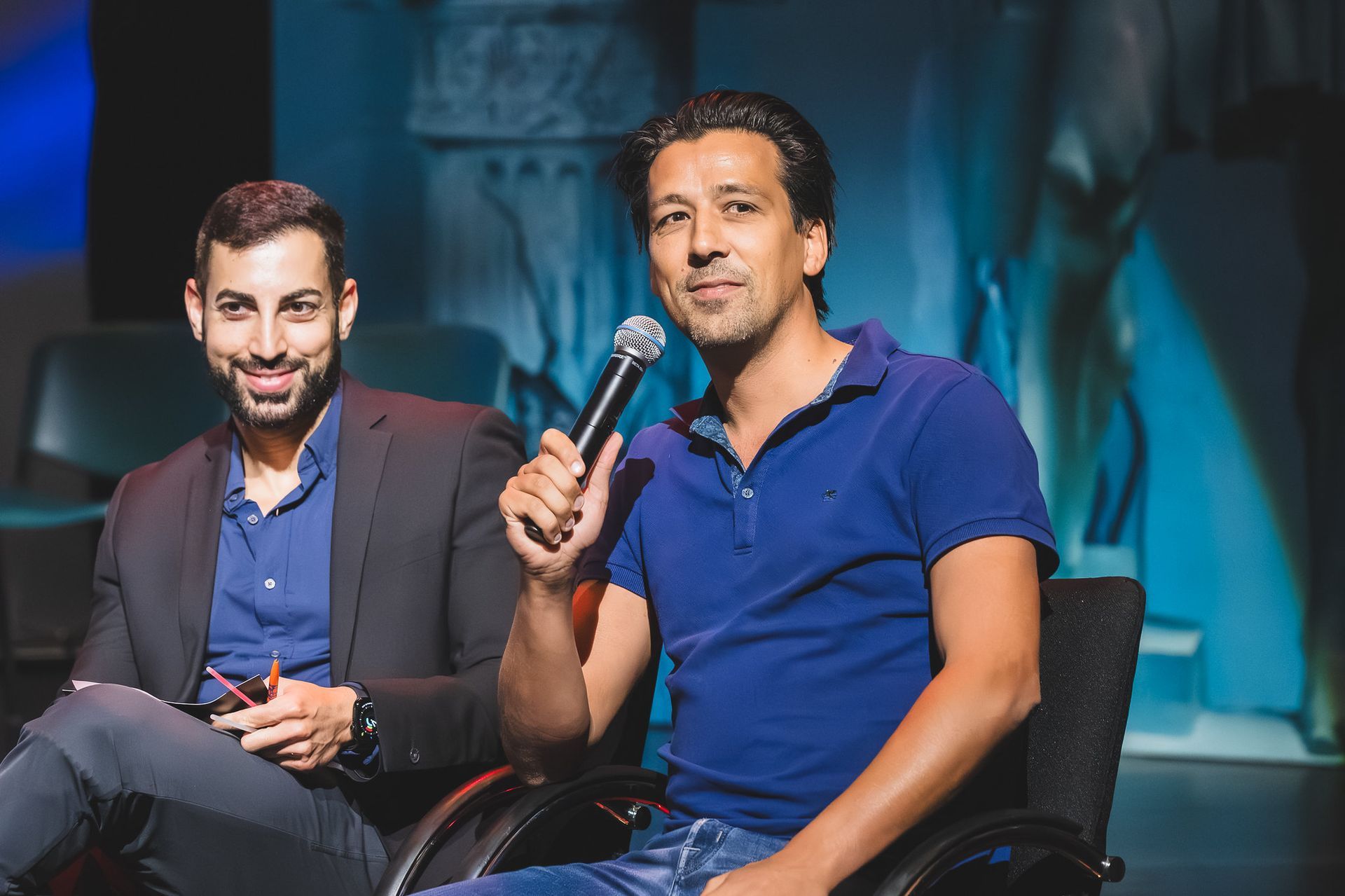 A group of people are sitting around a table in a room.