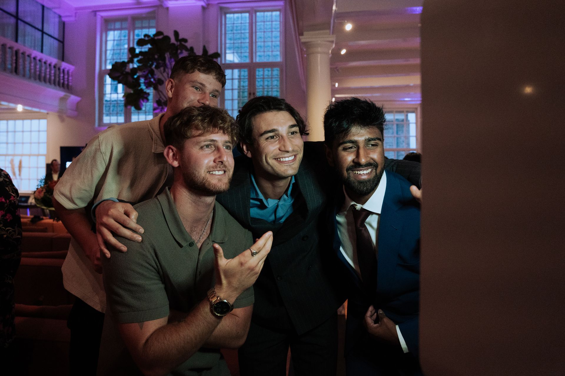 A group of young men are posing for a picture together.
