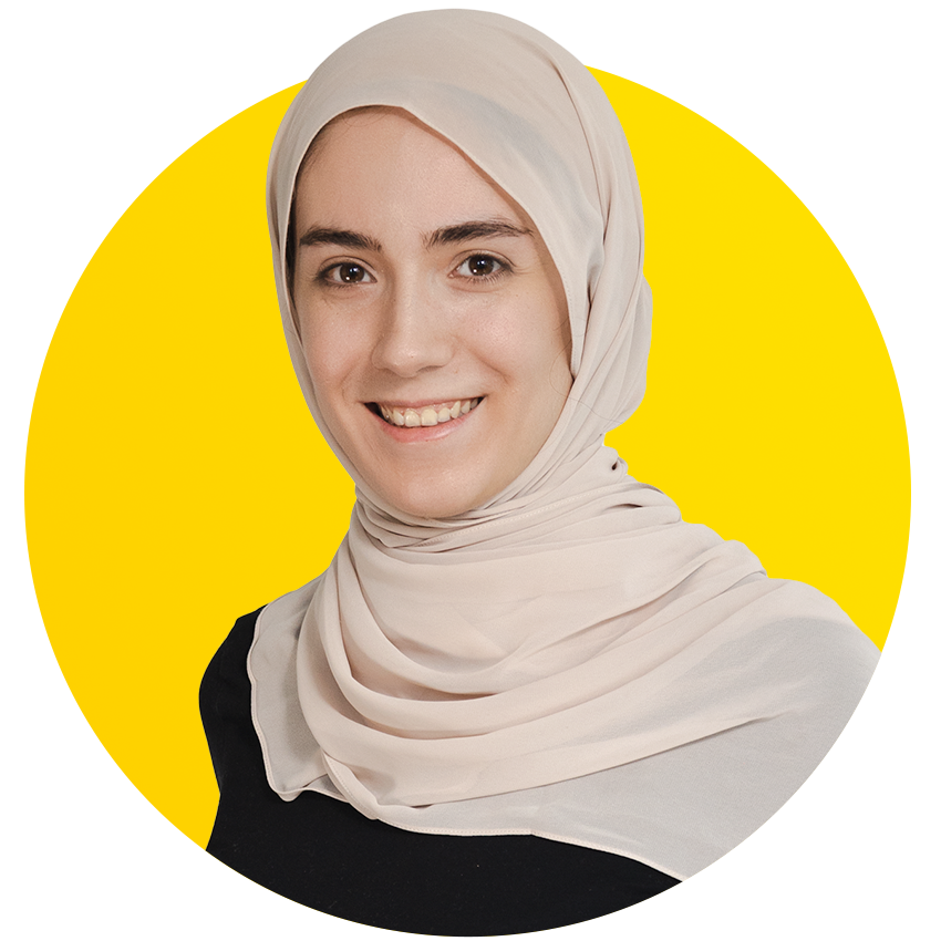 A woman in a black shirt is smiling in a yellow circle