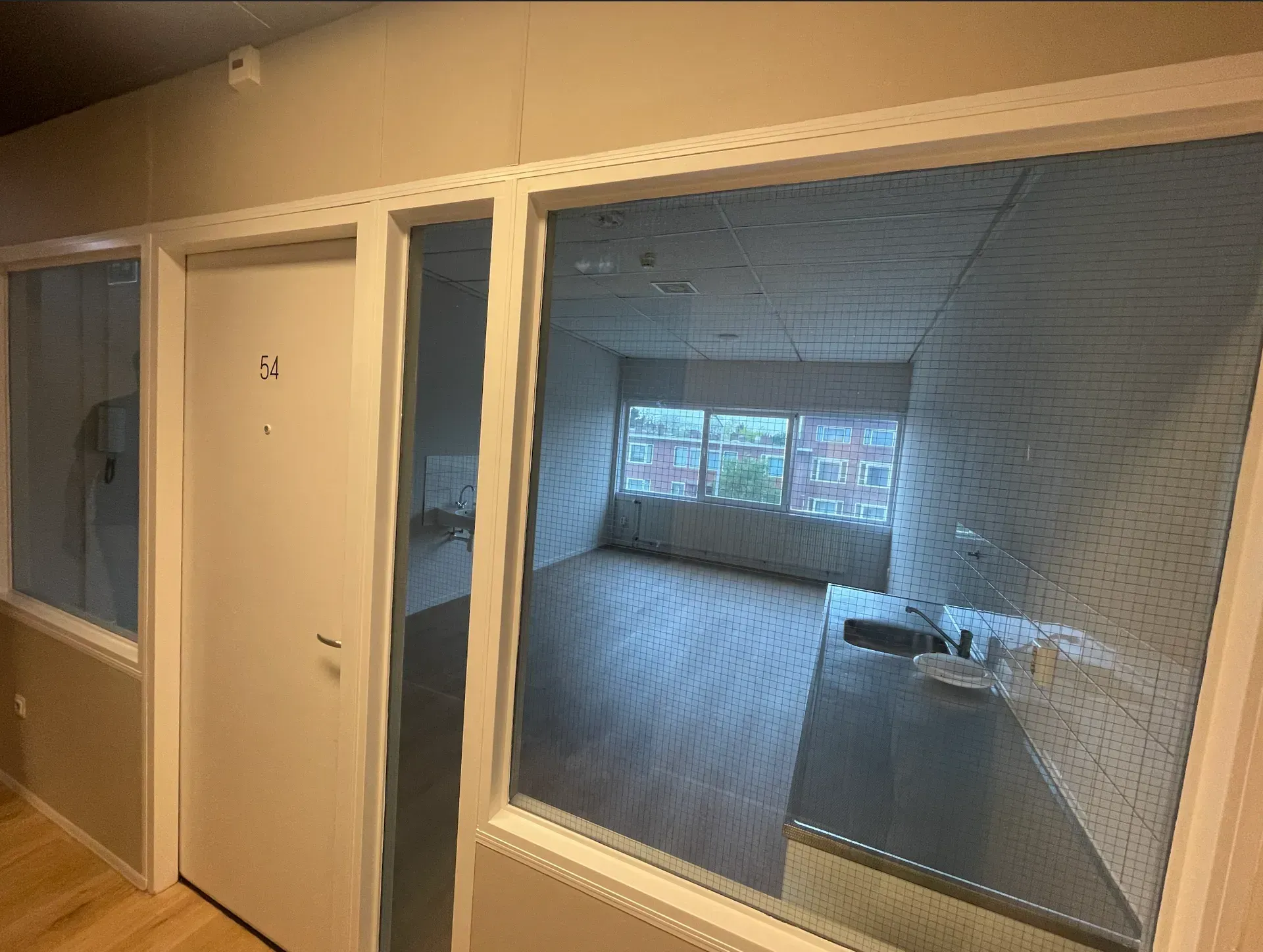 A room with a lot of windows and doors.