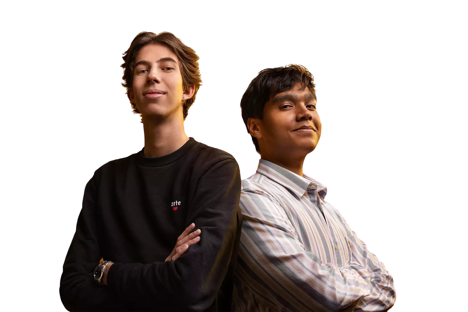 Two young men are standing back to back with their arms crossed.