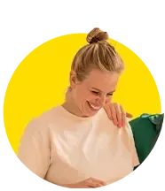 A woman in a white shirt is smiling in a yellow circle.