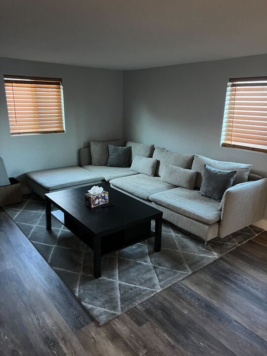 A living room with a couch and a coffee table