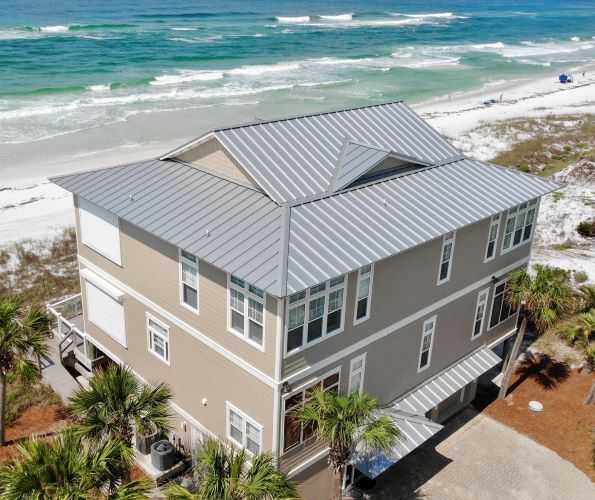 An aerial view of a house near the ocean