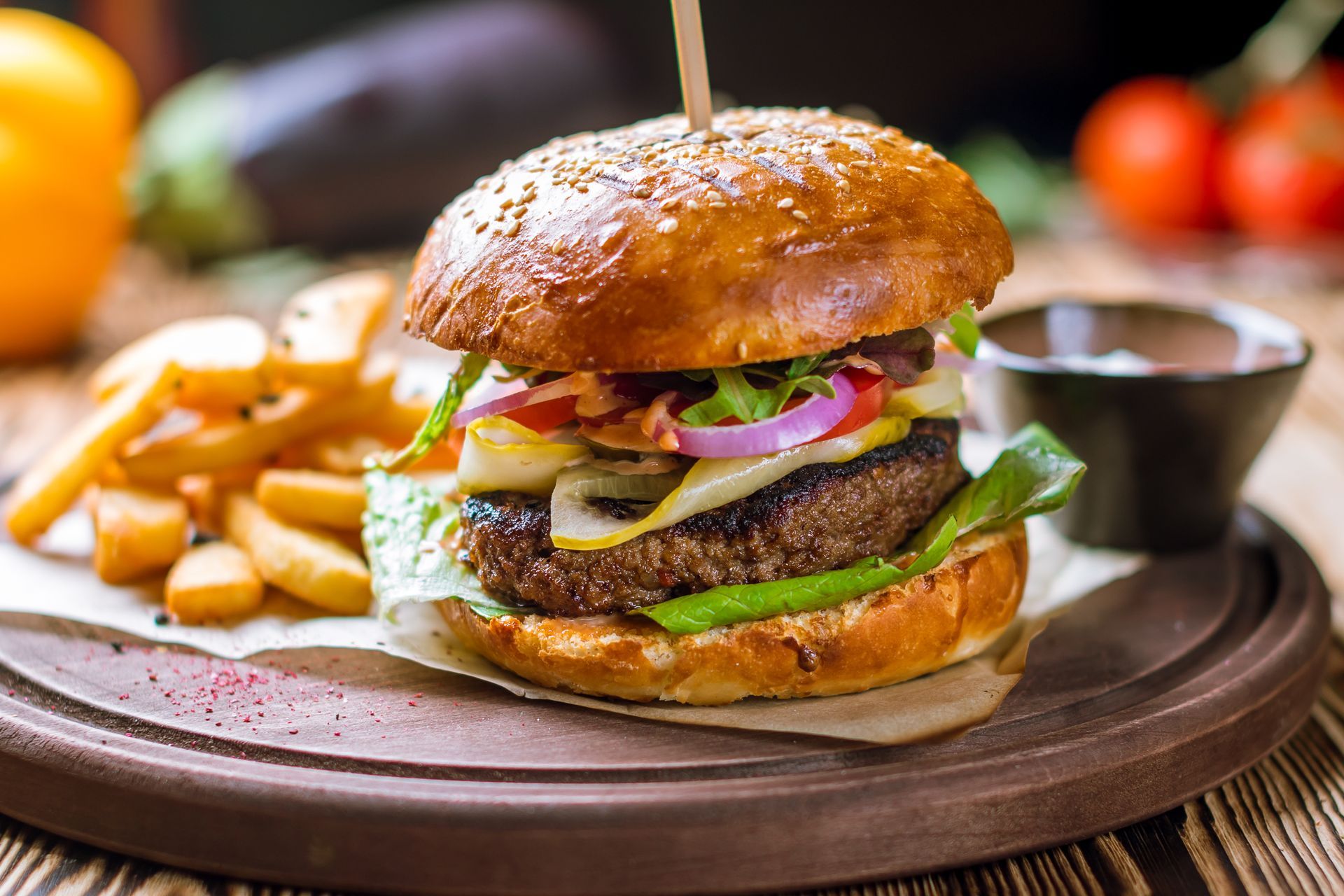 A sunset over a mountain range with a lot of fog