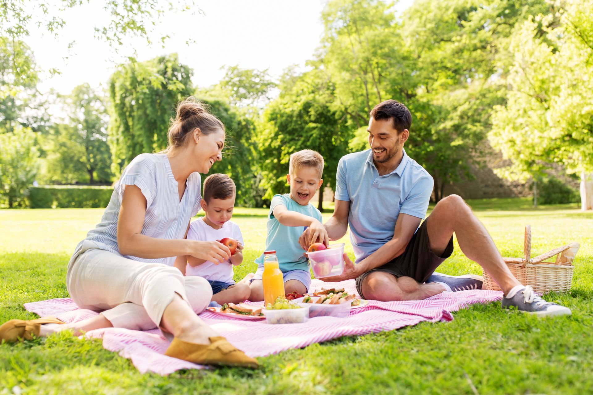A family is having a picnic in the park.