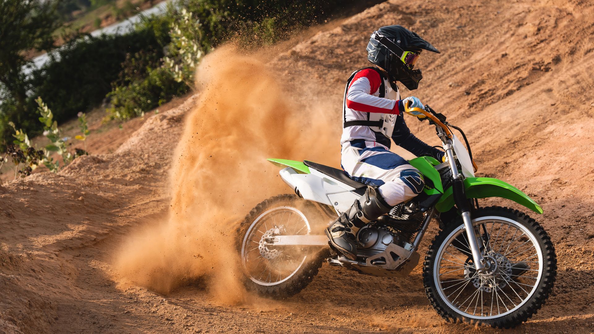 A sunset over a mountain range with a lot of fog