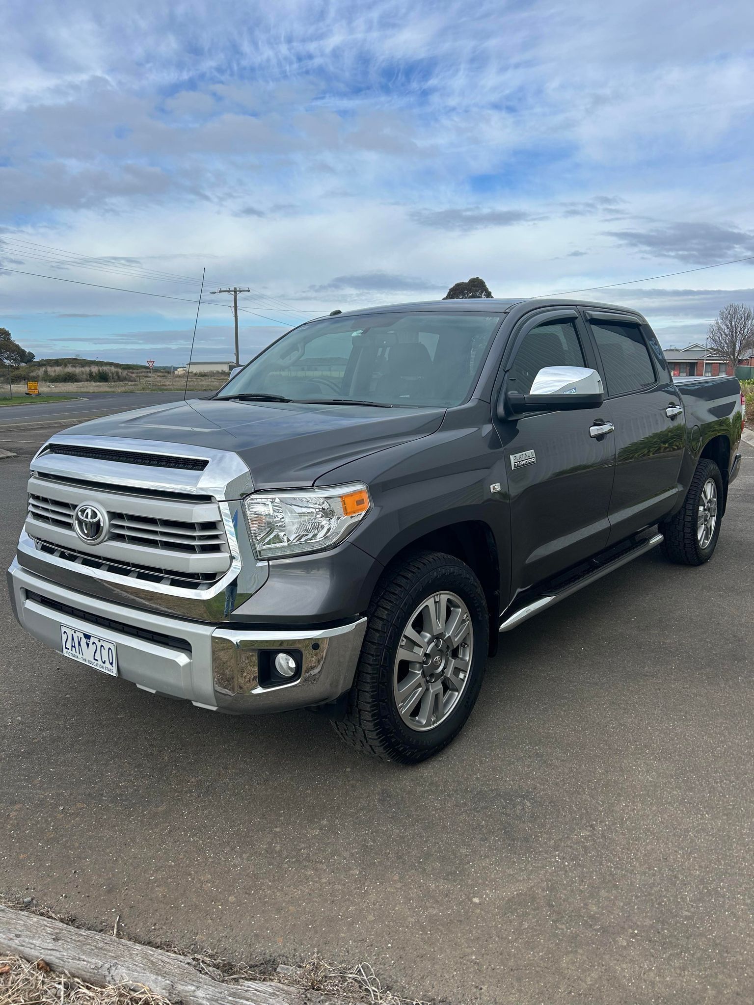 A toyota tundra is parked in a parking lot.