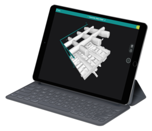 A tablet with a 3d model of a building on the screen