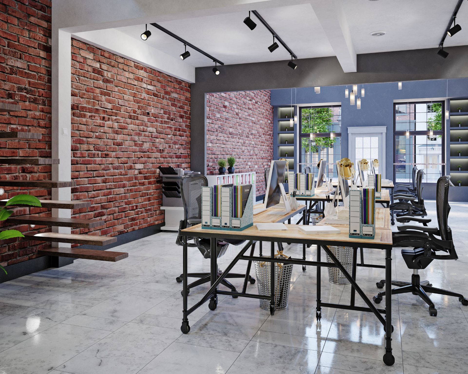 Modern office with brick wall, desks, computers, and chairs.