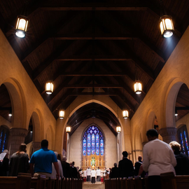 A religious procession with altar servers carrying candles and incense at an altar, in church.