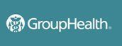GroupHealth logo featuring a circular icon with a medical caduceus symbol next to the text 